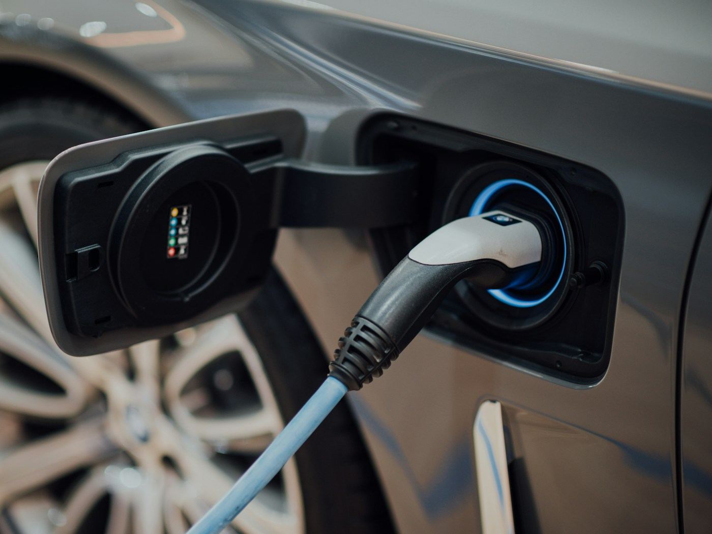Electric vehicle charging cable plugged into a car